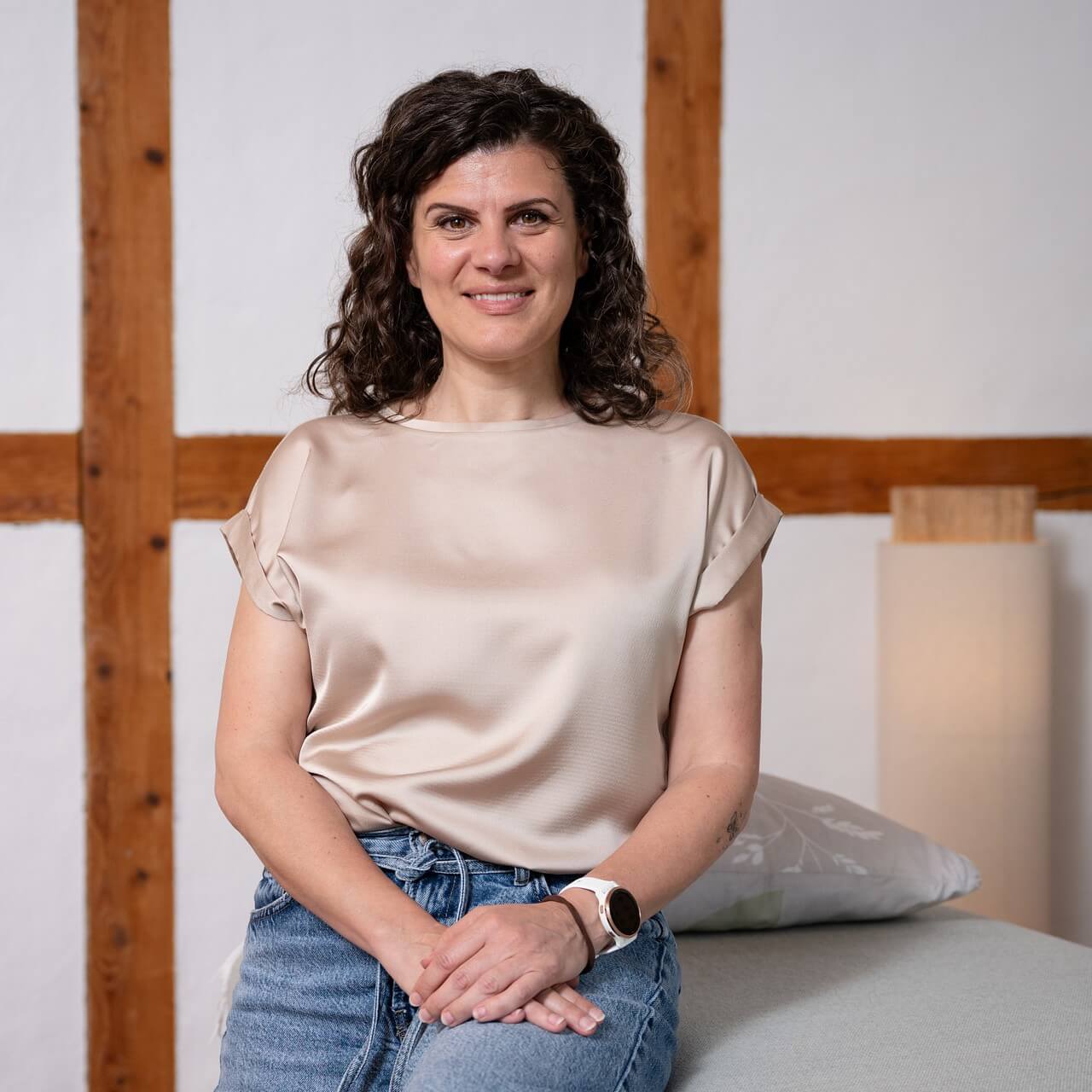 a woman sitting on a bed